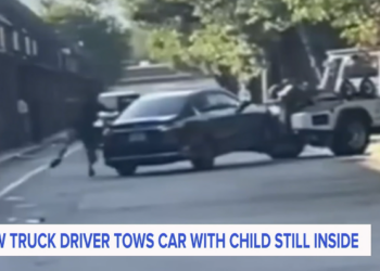 Tow truck driver allegedly towed car with child inside, who falls out of vehicle (video)