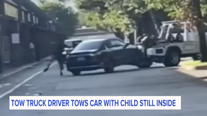 Tow truck driver allegedly towed car with child inside, who falls out of vehicle (video)